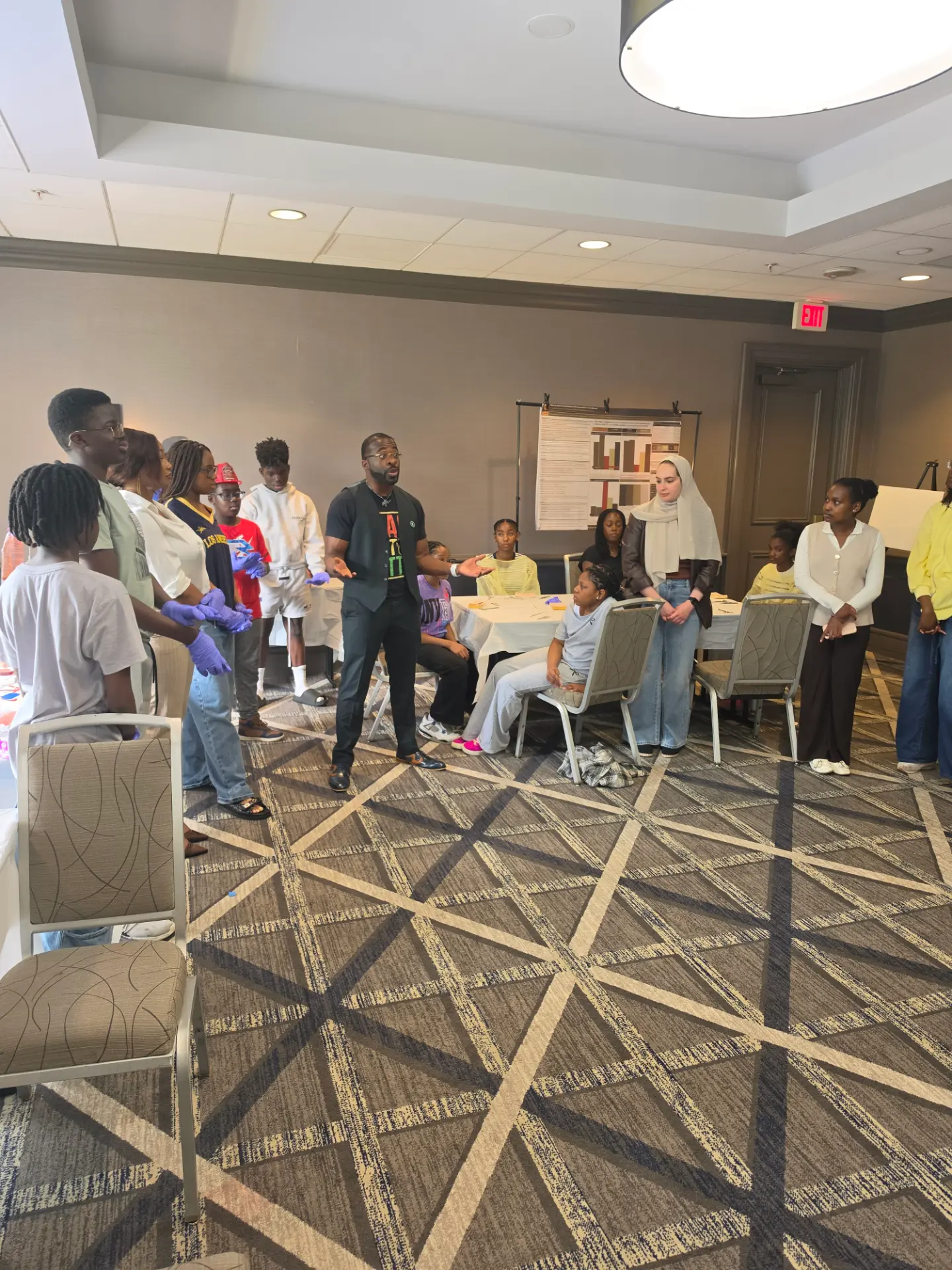 TGN mentor leading a hands-on workshop with students