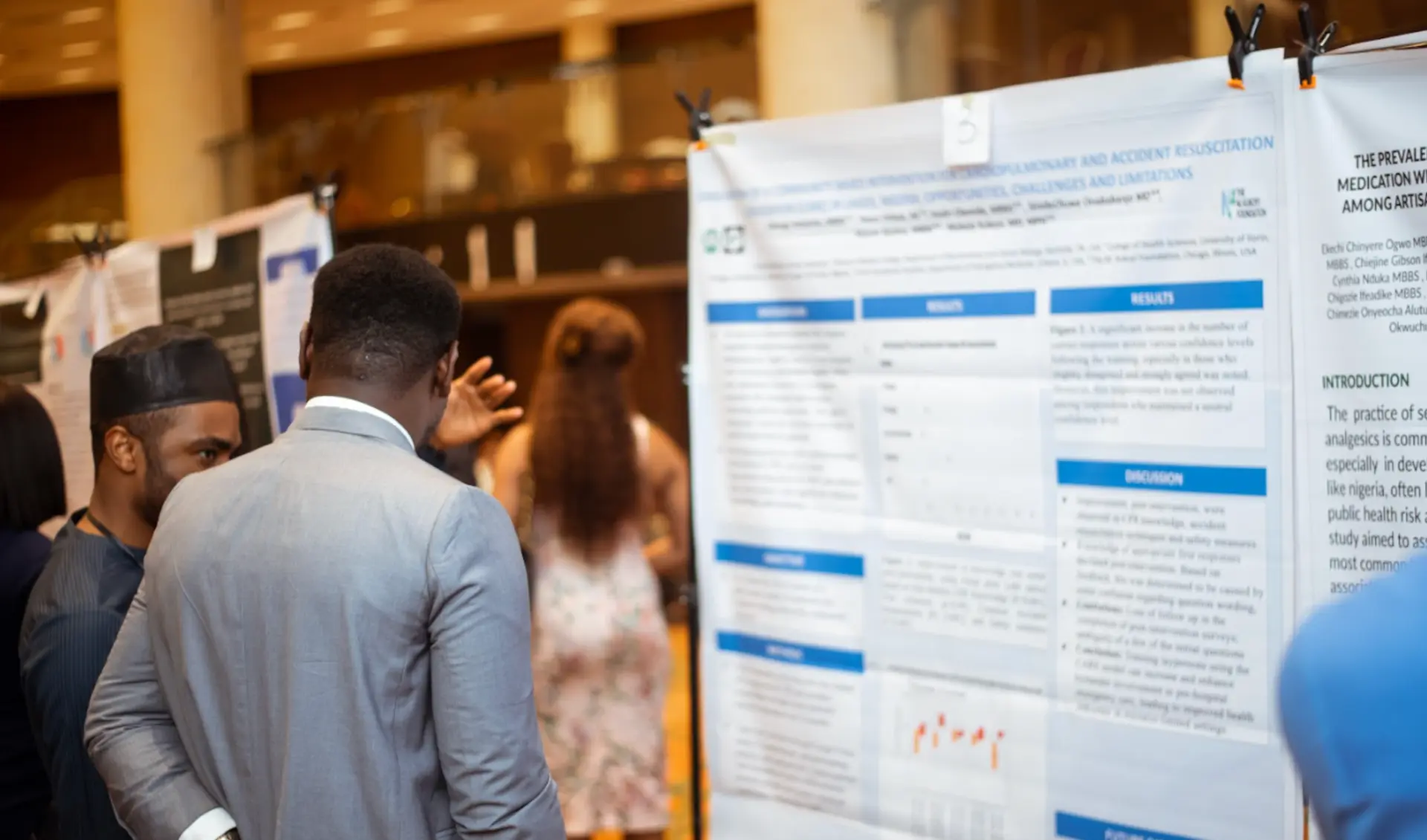 Students presenting research at a poster session