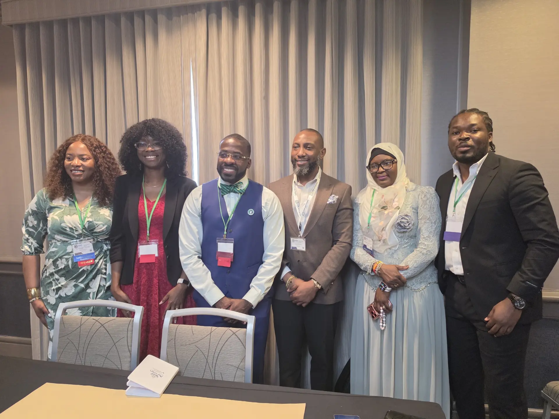 Thy Gifted Neighbor team at a conference